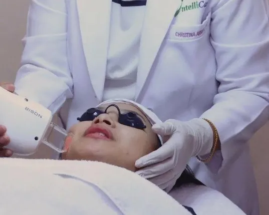 MERGE clinical trainer demonstrating a laser device at a Dubai clinic